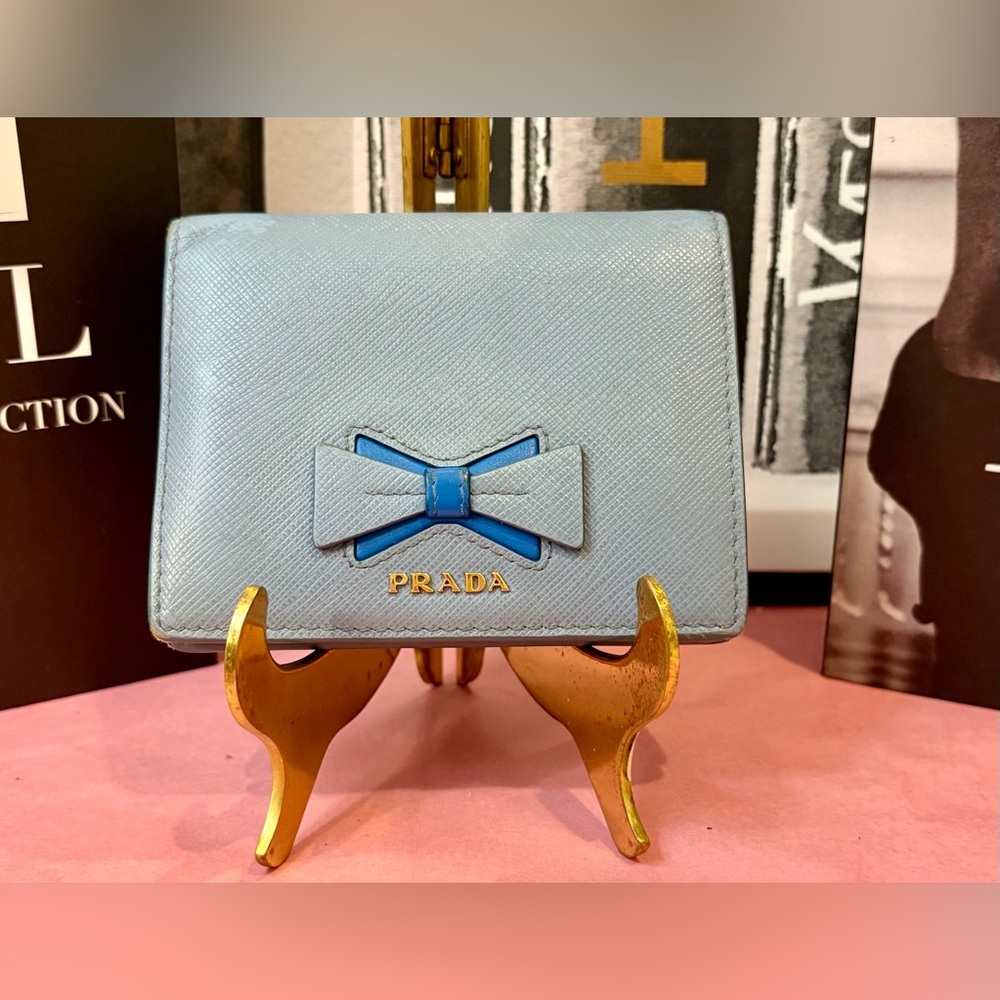 EUC PRADA Light Blue Saffiano Wallet with Blue Bow Accent and Gold-Tone Hardware